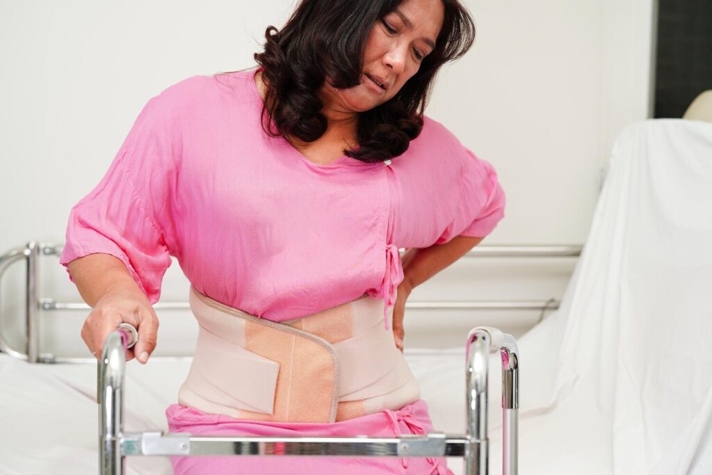 asian senior pain back wearing elastic support belt with walker 622428 1220 asian senior pain back wearing elastic support belt with walker 622428 1220