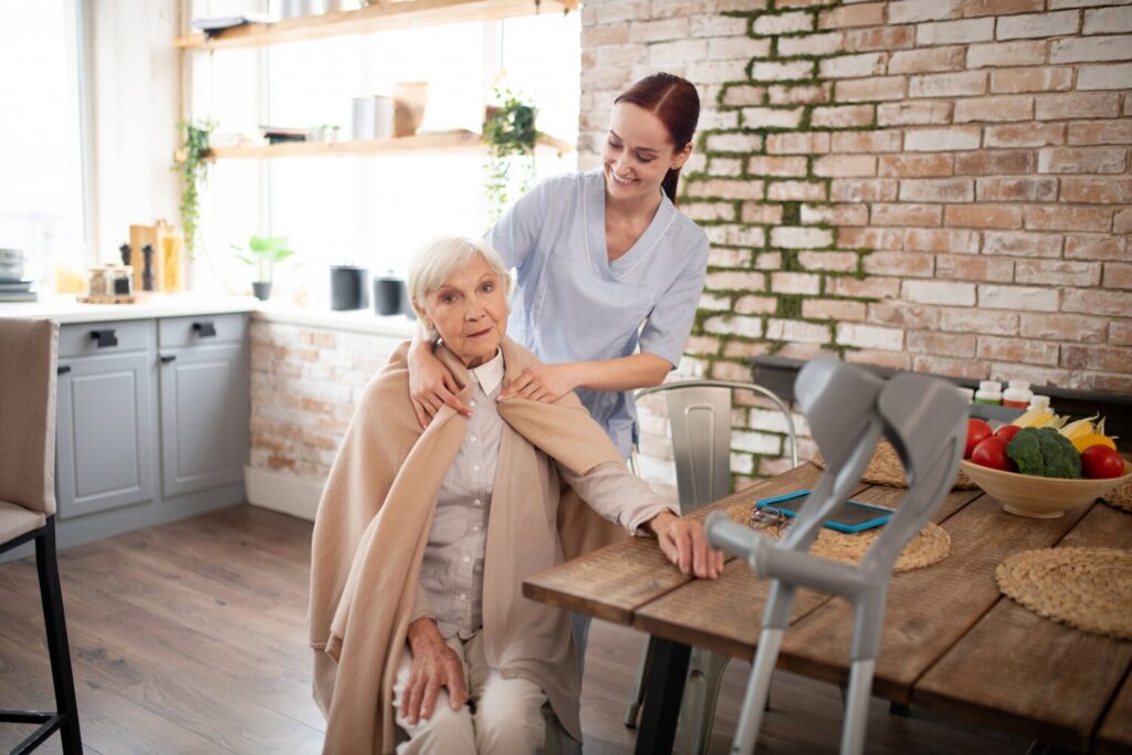 caring nurse putting plaid shoulders aged woman 259150 31 caring nurse putting plaid shoulders aged woman 259150 31