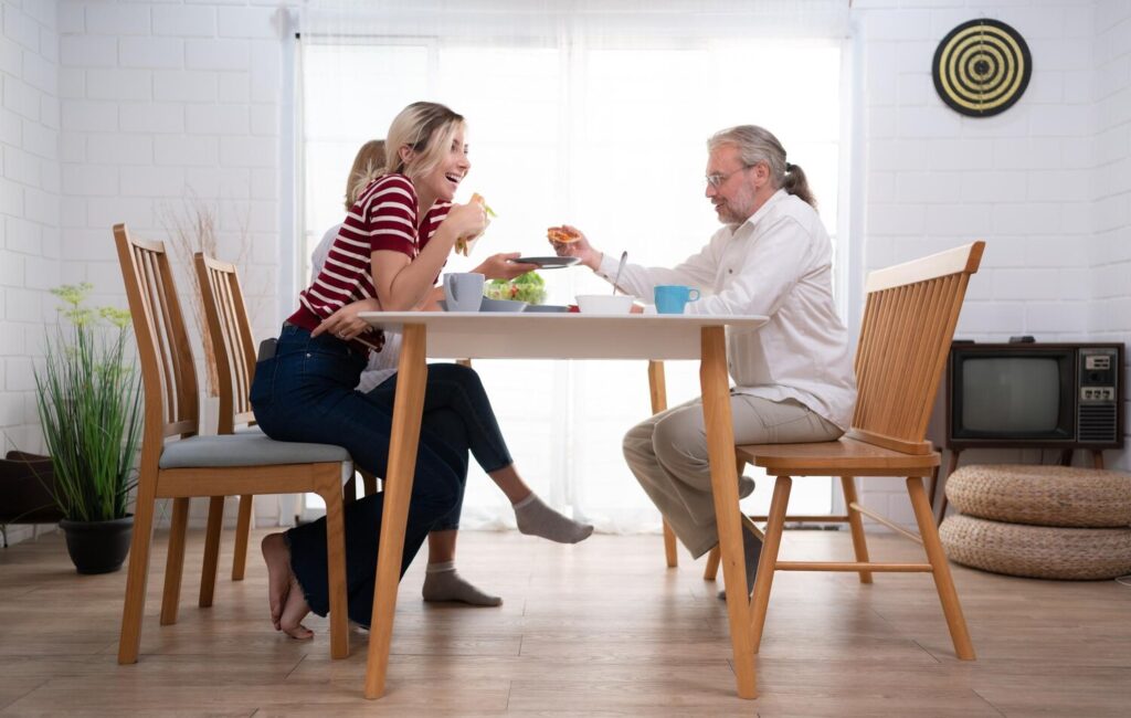 father mother daughter are delighted eat dinner together family table 921283 2590 father mother daughter are delighted eat dinner together family table 921283 2590